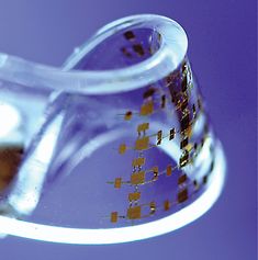 a glass beakle filled with liquid on top of a table