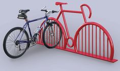 a blue bicycle is locked to a red bike rack