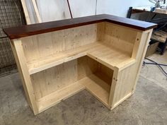 a wooden shelf sitting inside of a garage