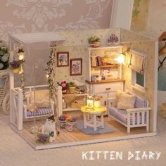 a doll house with furniture and lights in it