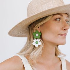 Our stacked flower earrings are back in an updated spring palette of green and white! Color: Green and WhiteDimensions: 2 3/4" x 1 1/2"Light-weight Buffalo HornStainless steel backYour earrings are made from all-natural material and as such the horn color may vary slightly from what is shown. While all horn is very similar in appearance, no two are exactly the same. This guarantees the uniqueness of each piece and ensures your amazing jewelry is truly one of a kind! The horn for this piece is so Spring Palette, The Horn, Water Buffalo, Your Amazing, Dress Hats, Dress Cover, Natural Material, Green And White, Flower Earrings