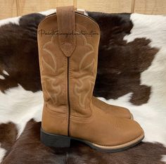 Check out this great looking pair of boots by Roper! This is a great riding/barn boot or just a nice everyday square toe boot for rocking with your favorite jeans. Square Toe Brown Leather Vamp Removable Insole Rubber Outsole 11” Shaft Height 1.5" Block Heel 15" Circumference of calf Measurements for this boot were taken from a size 9. Please note that measurements may vary by size. Square Toe Cowgirl Boots, Western Boots For Women, Barn Boots, Purple Square, Square Toe Western Boots, Western Store, Brown Square, Cowgirl Western, Boots For Women