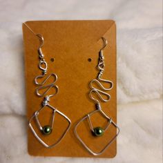 Wire Wrapped Earring With Aluminum Green Faux Pear Bead. Handmade Earrings Formal Pear-shaped Earrings With Ear Wire, Aluminum Wire Earrings, Green Dangle Wrap Earrings With Ear Wire, Green Teardrop Earrings With Ear Wire For Gift, Pear-shaped Earrings With Ear Wire For Gift, Green Wire Wrapped Metal Earrings, Monet Earrings, Cloisonne Earrings, Ivory Earrings