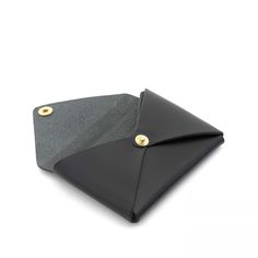 Il Bisonte's black brass snap closure leather card case. Stack 8-10 cards at one time. Folded Cash and 6 cardsVegetable tanned leather. Dimension 4" x 2.75" Made in Italy Black Envelope Wallet As A Gift, Leather Envelope Card Holder, Black Formal Wallets With Snap Closure, Leather Bifold Card Holder With Snap Closure, Black Textured Leather Wallet, Black Envelope, Black Leather Wallet Hand-stitched, Black Leather Wallet For On-the-go, Black Envelopes