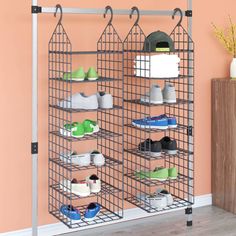 the shoe rack is holding several pairs of shoes in it's storage area,