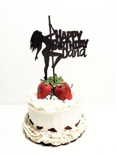 a birthday cake with strawberries and a happy birthday sign