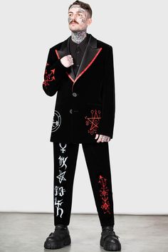 BEELZEBUB.- Statement non-stretch velvet fabric.- Contrasting satin collar.- Statement custom embroidery details.- XL peaked lapels.- Functional welt pockets.- Button down closure.- Classic suit jacket sillhouette.- Fitted.- Unisex, so it's for everyone! with KILLSTAR branding, Fabric 1: 100% Polyester. Trim: 97% Polyester, 3% Elastane. Lining: 95% Polyester 5% Elastane.Do not wash / Do not bleach / Do not tumble dry / Do not iron / Dry clean. Imported. Winter Velvet Single-breasted Outerwear, Winter Costume Suits With Long Sleeves, Velvet Long Sleeve Tuxedo Style Outerwear, Winter Velvet Suits With Lapel Collar, Velvet Tuxedo Style Long Sleeve Outerwear, Winter Single Breasted Velvet Suit, Winter Velvet Single Breasted Suit, Single Breasted Velvet Suit For Winter, Winter Velvet Single-breasted Suit