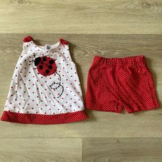 Nwot Baby Girl Sz 3-6m Kt Kenneth Too Summer Outfit. The Top Is White With Red Accents And A Cute Ladybug On The Front. The Shorts Are Red With White Polka Dots And Have A Stretchy Elastic Waistband. Red Cotton Short Sets, Cute Red Bottoms For Playtime, Playful Red Cotton Shorts, Strawberry Shortcake Outfits, Woman Costumes, Capri Outfits, Cute Ladybug, Girl Sweat, Seersucker Dress