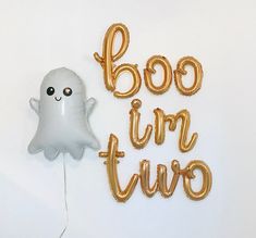 a balloon shaped like a ghost next to the words boo - tir - wee