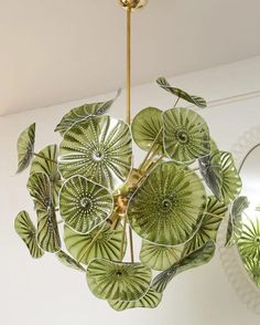 a green chandelier hanging from the ceiling