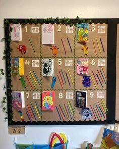 a bulletin board with lots of books and toys on it's sides, hanging from the wall