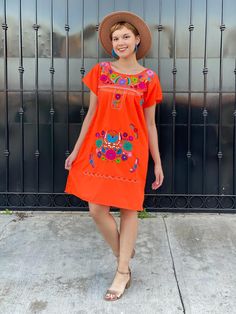 "Orange hand embroidered mexican dress for women, fiesta sundress, neon orange bikini cover up, cinco de mayo, boho hippie, mexican party A very bright and fun traditional Mexican dress, short sleeve, neon orange and multicolor hand embroidered flowers. Great piece to wear in spring, summer, mexican festivities or if you go to a Mexico destination vacay. Loose fit Made of Cotton Fits size SMALL Measurements taken flat: - Armpit to armpit 19 1/2\" - Width 23 1/2\" - Shoulder to bottom hem 37 3/4\ Red Embroidered Dress For Summer Vacation, Short Sleeve Floral Embroidery Dress For Beach, Short Sleeve Embroidered Dresses For Beach Season, Orange Boho Dress For Spring Beach Occasion, Vibrant Orange Beach Dresses, Short Sleeve Dresses For Cinco De Mayo Fiesta, Orange Spring Festival Dress, Casual Embroidered Summer Festival Dress, Bohemian Orange Summer Dress