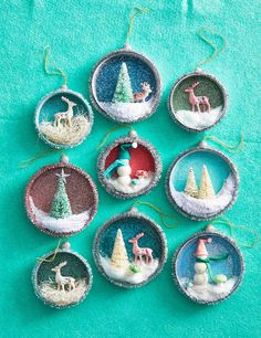 christmas ornaments are arranged in the shape of snow globes