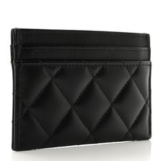 This is an authentic CHANEL Lambskin Crystal Quilted Studded CC Card Holder in Black. This stylish card case is crafted of diamond-quilted lambskin leather in black. The case features card slots on either side of the main compartment, with a crystal and silver Chanel CC logo on the front. Cc Card, Cc Logo, Lambskin Leather, Card Case, Card Slots, Slots, Card Holder, Chanel, Crystals