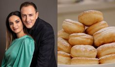 a man and woman standing next to a bowl of doughnuts