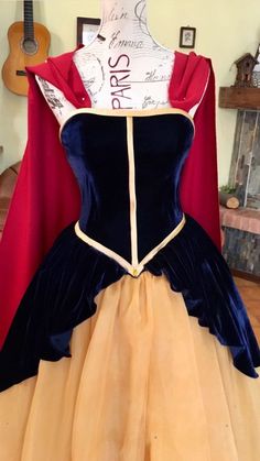 a dress made to look like snow white and the prince from disney's sleeping beauty