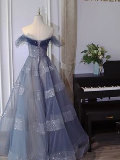 Blue Tulle Gown For Homecoming, Blue Tulle Ball Gown For Homecoming, Blue Off-shoulder Gown For Prom, Blue Tulle Evening Dress For Prom, Off-shoulder Tulle Gown For Formal Occasions, Blue Tulle Ball Gown For Prom, Blue Tulle Prom Evening Dress, Blue Strapless Tulle Evening Dress, Strapless Blue Tulle Evening Dress