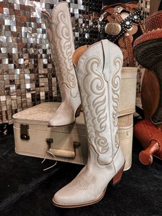 Embrace effortless Western elegance with these breathtaking boots. Crafted from buttery-soft suede in a dreamy, cloud taupe hue, they feature exquisite Western embroidery that adds a touch of authentic charm to the smooth, supple surface. The classic cowboy boot silhouette, with its pointed toe and stacked heel, provides both style and comfort. Perfect for dressing up or down, these versatile boots will become a go-to in your footwear collection. Express your awesome Western-inspired fashionista White Boots For Western-themed Events, Chic Leather Boots For Western-themed Events, Cream Boots With Reinforced Heel And Snip Toe, Cream Snip Toe Boots With Reinforced Heel, Western Cream Boots With Reinforced Heel, Cream Western Boots With Reinforced Heel, Western Style Cream Boots With Reinforced Heel, Cream Boots For Western-themed Spring Events, Cream Boots For Spring Western-themed Events