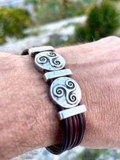 Silver and leather bracelet, boho style, for men, handmade. Bracelet with 5 leather strips and silver Celtic decorations (trisquel) This bracelet is made of genuine leather and silver clasps. All silver pieces are anti-allergic (nickel and lead-free) with an 8-micron sterling silver plating. You could wear this cute boho bracelet for  MEN on any occasion, formal or casual, making you look super chic and cute. This original boho bracelet could be a perfect gift for women, a friend, a loved one, o Celtic Bracelets For Men, Boho Style For Men, Bracelet Leather, Men's Bracelet, Mens Leather Bracelet, Boho Bracelet, Bracelet Boho, Unisex Bracelets, Handmade Bracelet