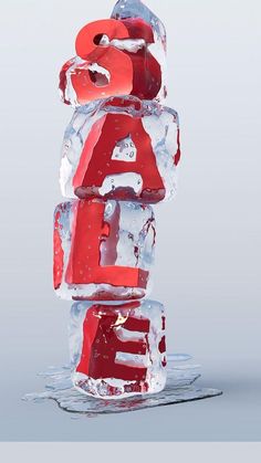 an ice sculpture with the letter e on it's side and red letters in the middle