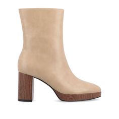 Looking to take your style to the next level? Look no further than the Romer booties from Journee Collection. These booties are made from high-quality vegan leather, making them both stylish and easy on the feet. With a faux wood platform and block heel, these booties are right on-trend. The center seam detail and almond toe give them a chic and sophisticated look. And with a 10 1/2-inch top circumference and comfortable 4 mm Tru Comfort Foam™ insole, they're as comfortable as they are stylish. Stylish Shoes For Women, Big Calves, Leather Making, Platform Block Heels, Over The Knee Socks, Wide Calf Boots, Wide Calf, Journee Collection, Calf Boots