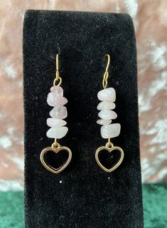 This listing is for one pair of earrings made from rose quartz crystals chips & gold heart charms attached to gold plated french ear wires. Rose quartz is a favorite crystal of the shop owner's, as it is a crystal representative of love. Rose quartz promotes healing & harmony, and is a great stone to help with maintaining loving relationships with oneself & others. Note: The appearance of the earrings, color, & exact measurements may vary, due to natural variations in the crystals. Crystal Stone Earrings, Quartz Earrings Diy, Halloween Crystal Jewelry, Chip Bead Earrings, Small Handmade Earrings, Crystal Chip Earrings, Gemstone Chip Earrings, Gold Rose Quartz Earrings For Gift, Diy Earrings For Beginners