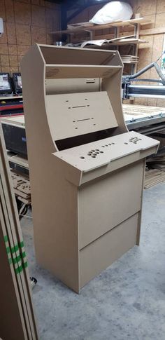 an old fashioned computer sitting on top of a table in a room with other equipment