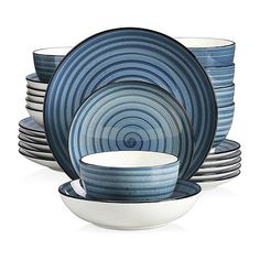 a stack of blue and white dishes on top of each other