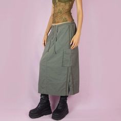 The Y2K Khaki Cargo Midi Skirt is a subversive grunge sporty utility vintage 2000s green striped skirt with pockets, front zipper closure, and side slits with snap buttons. ESTIMATED SIZE M TAG SIZE EUR 40 MEASUREMENTS Length 78cm - 30.70 inch Waist 80cm - 31.49 inch Hips 100cm - 39.37 inch Our model is 172 cm tall and usually wears size XS. Please be aware that some items may be slightly pinned on the model to demonstrate the correct fit. We ship worldwide from Spain and offer free shipping on all orders when you buy 3 items or more! ♥ https://adultworldshop.etsy.com ♥ WWW.ADULTWORLDSHOP.NET ♥ INSTAGRAM & TIKTOK @adultworldshop Midi Skirt Y2k, Vintage Midi Skirt, Cargo Khaki, Skirt Y2k, Striped Skirt, Vintage 2000s, Green Skirt, Skirts With Pockets, Khaki Green