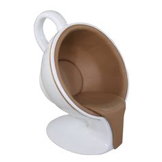 a white and brown chair sitting on top of a table