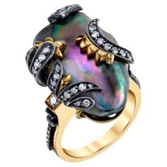 This eye-catching ring features a large, 16.60 carat natural abalone pearl set in 18k yellow and white gold. Abalone pearls are not cultured like most commercially available pearls seen in fine jewelry. They form naturally and are highly prized because of their rarity, unusual shapes, and because they exhibit a beautiful rainbow of colors like those lining the inside of the abalone shell! This sizeable pearl is set in 18k white and yellow gold, with sparkling diamonds that wrap around the pearl Luxury Gold Jewelry With Abalone Shell, Gold Abalone Shell Necklace In Unique Style, Ocean-inspired Abalone Shell Jewelry, Handmade Ocean-inspired Abalone Shell Jewelry, Handmade Abalone Shell-shaped Jewelry, Alexis Bittar Jewelry, Gold Cocktail, Gold Cocktail Ring, Pearl Set