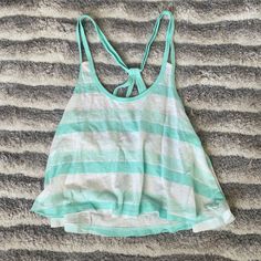 Light Blue And White Stripe Crop Top Size: Xs Brand: Hollister Colors: Light Blue, Mint Blue And White Condition: New With Tag Great Spring And Summer Shirt Comes From A Smoke And Pet Free Home Casual Striped Tank Top For Vacation, Casual Striped Tank Top For The Beach, Light Blue Cotton Tank Top For The Beach, Light Blue Casual Beach Crop Top, Striped Summer Tops For Beach, Striped Summer Tops For Beach Season, Casual Light Blue Crop Top For Vacation, Striped Crop Top For Beach, Casual Blue Tank Top For Beach Season