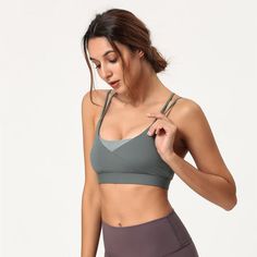 The EMES SHOP sports bra is detailed with a scoop neckline. double shoulder straps. and contouring seams. Features a criss cross back and an adjustable clasp. This breathable. quick-drying. and supportive sports bra is perfect for any high impact workouts. MATERIAL: 80% Nylon. 20% Spandex MEASUREMENTS: * Small | Bust: 27.6" in . Band: 23.6" in . Length: 11.8" in * Medium | Bust: 29.1" in . Band: 25.2" in . Length: 12.2" in * Large | Bust: 30.7" in . Band: 26.8" in . Length: 12.6" in * X-Large | Bust: 32.3" in . Band: 28.3" in . Length: 13" in MEASUREMENTS: * Small | Bust: 70" cm . Band: 60" cm . Length: 30" cm * Medium | Bust: 74" cm . Band: 64" cm . Length: 31" cm * Large | Bust: 78" cm . Band: 68" cm . Length: 32" cm * X-Large | Bust: 82" cm . Band: 72" cm . Length: 33" cm Strappy Sports Bra With Built-in Bra, Gray Activewear With Built-in Bra For Sports, Gray Sports Bra With Built-in Bra For Pilates, Yoga Sports Bra With Wide Moisture-wicking Straps, Supportive Gray Sports Bra With Built-in Bra, Racerback Sports Bra For Pilates, Sportswear Strappy Back Sports Bra For Yoga, Sporty Sports Bra For Light Exercise With Wide Straps, Light Support Sports Bra With Wide Straps For Workouts