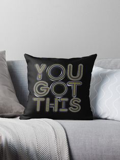 a black pillow with the words you got this on it sitting on top of a couch