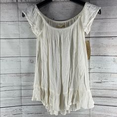 Brand New With Tags! Color: Cream Width: 30.5 In Length: 19.5 In White Flowy Cotton Tops, White Flowy Cotton Blouse, Flowy White Cotton Blouse, Casual Cream Flowy Tops, Flowy Cream Casual Tops, Flowy White Beach Top, Casual Off White Flowy Tops, Casual Flowy Off White Tops, White Bohemian Top For Daytime