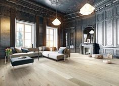 a living room filled with furniture and lots of windows