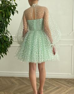 Indulge in the magic of our "Gemma" homecoming dress. Crafted from light, heart-shaped dot tulle fabric, dress Gemma radiates a unique charm that's impossible to ignore. The dress comes with an illusion corset bodice that accentuates your figure and provides a flattering silhouette. It features a high-neck illusion neckline, adding an alluring element to the outfit. This stylish feature is perfectly complemented by long puffy sleeves, balancing contemporary style and traditional elegance. Whethe Brithday Dress, Simple Evening Gown, High Neck Prom Dress, Figure Flattering Dresses, Mode Tips, Mint Green Dress, Mini Homecoming Dresses, Green Tulle, Prom Dresses Gowns