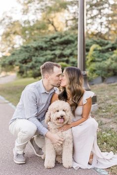 Engagement photos with dog in Saint Paul, Minnesota with goldendoodle Engagement Photo Dog, Engagement Photoshoot Ideas With Dogs, Engagement Photoshoot With Dog, Engagement Pictures With Dogs, Couple Photo With Dog, Engagement Pics With Dog, Engagement Photos Poses With Dog, Engagement Photo Inspo With Dog