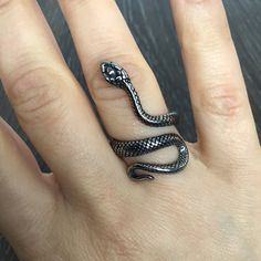 Beautifully crafted full of details large snake ring is made of Stainless steel.Ring has some oxidation to add details and depth.Ring is unisex  suitable for both men and women.-Snake size- 1 1/4 inches long-Ships in a gift box. Black Snake Rings, Snake Jewelry Rings, Snake Ring Tattoo, Joan Aesthetic, Snake Ring Aesthetic, Snake Jewelry Ring, Alt Rings, Rings Snake, Character Headcanons