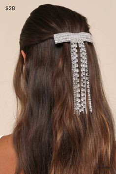 We can't imagine a more perfect finish to your look than the Lulus Sparkling Sophisticate Silver Rhinestone Bow-Shaped Barrette! This completely iconic hair barrette boasts a bow-shaped design, encrusted with cubic zirconia rhinestones in baguette and round cuts. The tails of the bow form two adorable sections of fringed rhinestone trim, for a look that was meant to shine under the spotlight! Barrette closure. Measures 4" Wide And 6. 5" Long. 60% Metal, 40% Cubic Zirconia. Imported. Lulus | Spar Iconic Hair, Occasion Outfit, Rhinestone Hair Comb, Diamond Bows, Satin Ribbon Bow, Bow Hair Accessories, Rhinestone Bow, Rhinestone Trim, Special Occasion Outfits