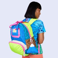 This item, once sold out, will be discontinued and will not return. The Camp Kawaii colorway is being discontinued and will not return once the remaining items have sold. The ultimate go-to style. Mid-size backpack with a large wide-open front zipper pocket. 3D pockets on both sides to stash your umbrella or water bottle. Webbing tote handles featuring easy grab front and back strap with matching logo snap. Inside zipper pocket and back suitcase trolley sleeve for easy travel. Adjustable padded Playful Nylon Backpack, Multicolor Backpack With Removable Pouch, Multicolor Standard Backpack With Removable Pouch, Playful Nylon Standard Backpack, Retro Outdoor Backpack, Multicolor Backpack With Zipper Pocket For School, Multicolor Backpack With Zipper Pocket For Back To School, Multicolor Standard Backpack With Zipper Pocket, Retro Standard Backpack For Back To School