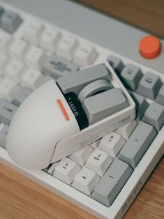 a computer mouse sitting on top of a keyboard