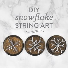 three wooden snowflake buttons with the words diy snowflake string art