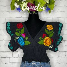 Beautiful and Chic. Our Butterfly Sleeve Crop Top is sure to make a statement. One-Size elastic waist top with embroidered V-Neck and sleeves. Made of 100% Cotton and embroidered in fine cotton yarn. Item is available in a One-Size only. Fits small to X-Large US sizes. The use of body tape is highly recommended for keeping sleeves in place. Complete the look with our handmade earrings and leather wedges and matching hat CARE: • Hand wash in cold water. • Hang dry.• Do not machine dry. Each desig Casual V-neck Top With Embroidered Sleeves, Casual V-neck Embroidered Top With Multicolor Embroidery, Multicolor V-neck Top With Floral Embroidery, Embroidered Cotton V-neck Blouse, Traditional Embroidered V-neck Peasant Top, Multicolor Floral Embroidered V-neck Top, Multicolor Embroidered Cotton V-neck Top, Casual V-neck Top With Multicolor Embroidery, Embroidered V-neck Festival Top