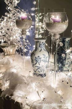 The feathers almost look like snow in the lights | Blue and white Christmas home decorating ideas Holiday Table Inspiration, Christmas Home Decorating, Blue And White Ginger Jars, Decorating Ideas Christmas, Gold Table Setting, Blue And White Christmas, White Christmas Lights, Christmas Light Installation, Hanging Christmas Lights