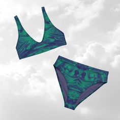 Look stylish in our Sea Green/Bluish Purple Recycled High Waisted Bikini. This cool colored high waisted bathing suit is a dream come true for really cool swimwear enthusiasts. Enjoy the bold and beautiful colors in our colorful bikinis and make a statement at the beach. Our suits are perfect for all age groups, from teen to adult.  We are unable to offer cancellations as this is custom made for you and production often starts immediately after purchasing. Please measure yourself with a measuring tape to ensure the best fit. (The size chart is accurate) Great fitting and sizing. Always rinse your suits after use.  UPF50+ protection: UPF clothing provides a physical barrier against UV rays, reducing the risk of sunburn, skin aging, and skin cancer. Double layered and non-reversible Removabl Green Fitted Swimwear For Surfing, Beachy Green Swimwear Bra Friendly, Green Seamless Swimwear For The Beach, Green High Waist Swimwear For Sunbathing, Green High-waist Swimwear For Sunbathing, High Waist Green Tankini For Sunbathing, Green High-waist Tankini For Sunbathing, Beachy Green Seamless Swimwear, Green Seamless Beachy Swimwear