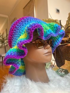 Stay stylish and on-trend with this handmade crochet ruffle hat. Made with soft and durable yarn, this hat is perfect for adding a touch of boho-chic to any outfit. The classic ruffle/bucket hat style is updated with a unique crochet design, making it a versatile and fashionable accessory for any season. Whether you're out for a day of shopping or heading to the beach, this hat is sure to keep you looking cool and feeling comfortable. Treat yourself or a loved one to this must-have accessory and add a touch of handmade charm to your wardrobe. Handcrafted with care and attention to detail, this crochet ruffle/bucket hat is a true statement piece that you'll love to wear again and again. Thank you for supporting my business and choosing handmade! CARE: Hand wash in cold water with detergent. Crochet Bonnet For Beach, One Size, Hand Knitted Sun Hat One Size Fits Most, Bohemian Multicolor Crochet Hat With Short Brim, Bohemian Knitted Short Brim Hat, Bohemian Hand-knitted Crochet Hat, One Size, Crochet Yarn Bonnet For Beach, Adjustable Crochet Hat, One Size Yarn Bonnet For The Beach, One-size Yarn Bonnet For Beach