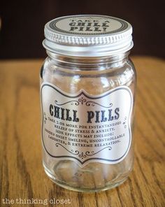 a glass jar filled with sand sitting on top of a wooden table