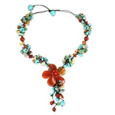 Orange agate and bright carnelian bring summer's warmth to a beautiful necklace. The lavish beaded strand culminates in a floral pendant. This design comes from Thailand's Nareerat. Length may be adjusted. Agate, carnelian, dyed magnesite, aventurine and resin on nylon cord Toggle clasp Handmade in Thailand Thai Garden, Orange Agate, Y Necklace, Flower Agate, Red Necklace, Floral Pendant, Orange And Turquoise, Summer Necklace, Black Necklace