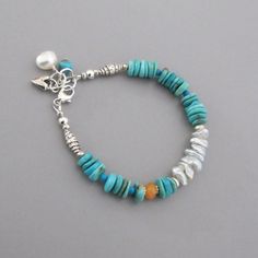 "Beautiful polished American Turquoise, pale icy blue Keishi Pearls, and a solitary Carnelian mingle with handmade silver beads. It closes with a lobster claw clasp and has an extender chain. A Turquoise nugget, a white freshwater pearl and a little handmade silver heart charm drop from the end of the chain. All metal is solid .925-.970 sterling and fine silver. This bracelet is made to order and will vary slightly from the photos. Turquoise - approx. 8, 5 and 3mm Carnelian - approx. 6.5mm Pearl Rustic Blue Adjustable Beaded Bracelets, Rustic Adjustable Blue Beaded Bracelet, Rustic Blue Adjustable Beaded Bracelet, Adjustable Light Blue Bohemian Bracelets, Rustic Turquoise Bracelet Jewelry, Rustic Turquoise Bracelet, Turquoise Gemstone Beaded Bracelets In Bohemian Style, Bohemian Blue Beaded Bracelets With Gemstone, Bohemian Turquoise Gemstone Beaded Bracelets